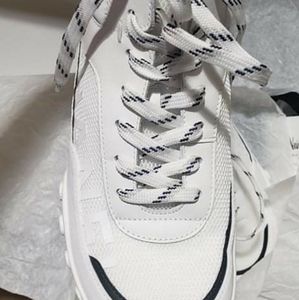Chanel sneaker sports field